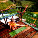 Volunteer painting a sign